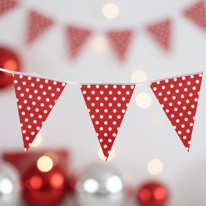 Close up detail of red and white polka dot bunting triangular flags hung with string