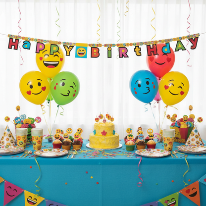 Emoji Happy Birthday letter banner strung across party table as backdrop with cupcakes