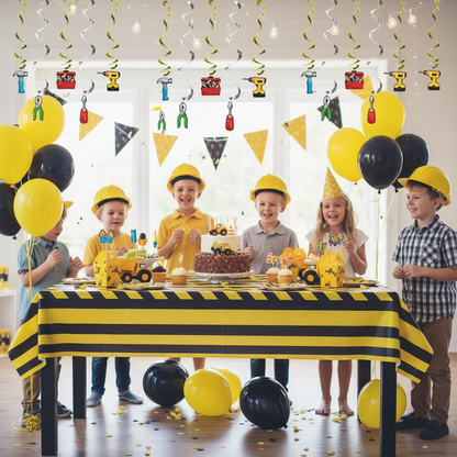 Boys construction birthday party with yellow green swirl danglers construction tool cutouts yellow black balloons and cake table