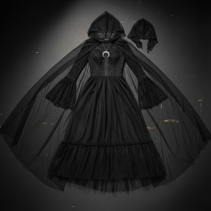 Spooky sassy black witch costume flat lay showing long black dress with dramatic sheer net cape