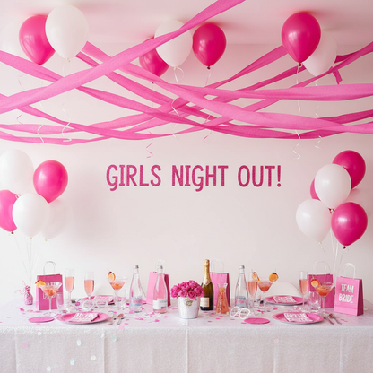 Hot pink streamers at bachelorette party setup