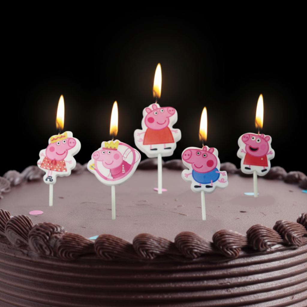 Peppa Pig candles lit on chocolate birthday cake dark moody style